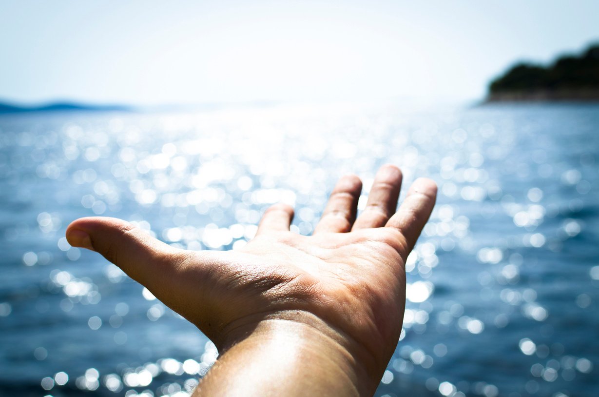 Man Feeling Freedom on Open Sea